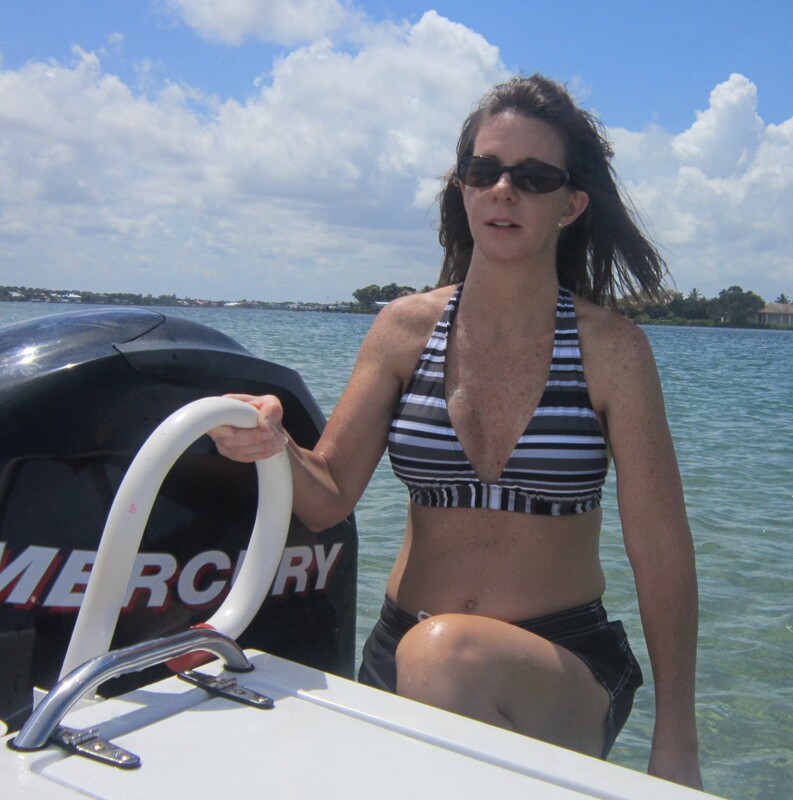 Boarding a boat from the water with a safety handle add-on boat accessory